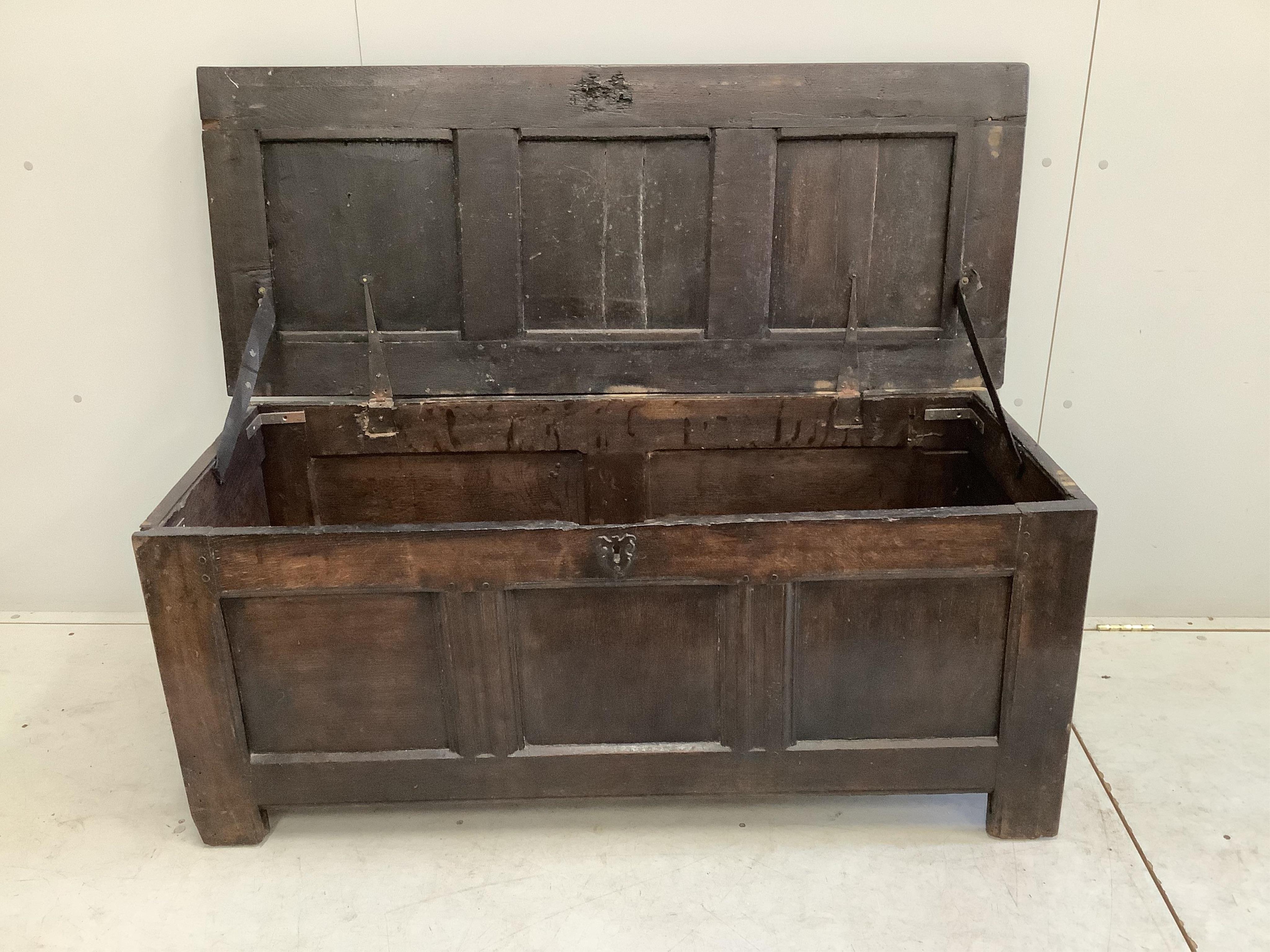 An 18th century oak coffer, width 136cm, depth 54cm, height 56cm. Condition - poor to fair